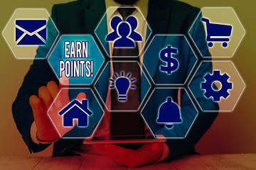 Conceptual hand writing showing Earn Points. Concept meaning collecting scores in order qualify to...