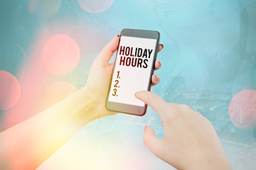 Conceptual hand writing showing Holiday Hours. Concept meaning employee receives twice their normal...