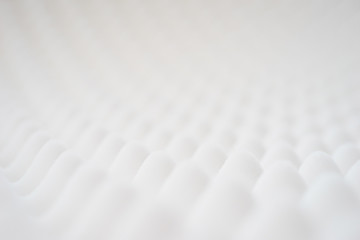 White gradient abstract background with many waves at different angles.