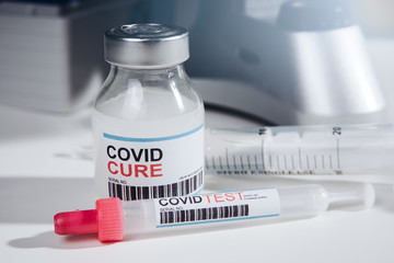 Coronavirus COVID-19 vaccine glass bottle in the laboratory. Cure for coronavirus un a test tube....