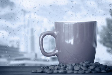 coffee cup on a rainy day window background