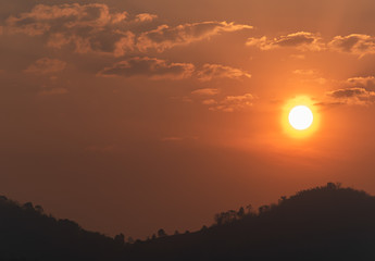 The sun on the orange sky in the morning and the mountain view
