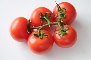 Fresh Organic Tomatoes on a white background