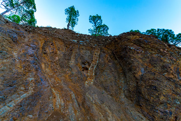 Geological formation with lava colums after magma eruption from stratovolcano