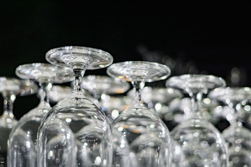 Clean glasses are collected on a shelf.