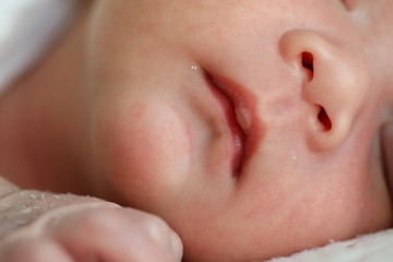 close up mouth and nose newborn baby softness sensitive skin