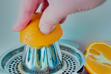 orange which is pressed on a citrus press