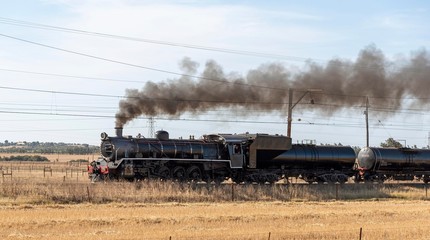 Hermon, Swartland region, South Africa. Dec 2019. Ceres rail black loccomotive approaching Hermon  at speed