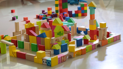 Obraz premium wooden toy block building town for activity of kid play learning development in home