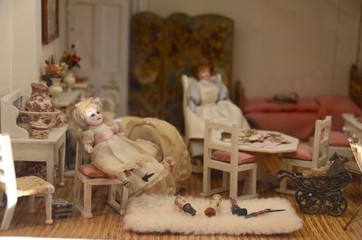 Dolls inside the room of a doll house