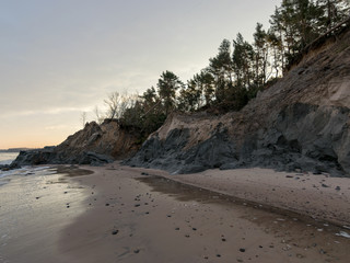 sea landscape. steep shore under the influence of rain and wind