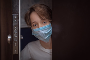 social isolation, masked teenager opens the door, prevention of acute respiratory viral infections