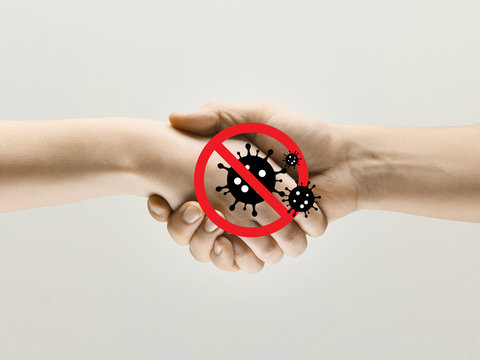 Human hands shaking, avoid greeting while coronavirus epidemic - concept of spreading of virus. Danger way of epidemic. Caution, outbreak alert. Stay safe. Prevention, safety, pandemic spread concept.
