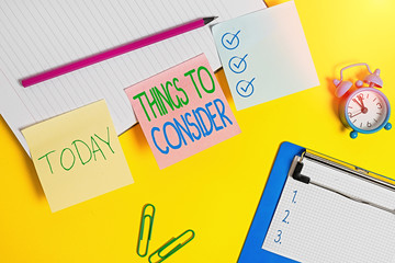 Text sign showing Things To Consider. Business photo text think about something carefully in order to make decision Flat lay above table with blank papers with copy space for text messages