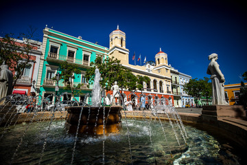 Fountains in front of the Plaza de Armas in Viejo San Juan, Puerto Rico. - obrazy, fototapety, plakaty
