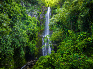 Maui, Hawaii Hana Highway - Wailua Falls, near Lihue, Kauai. Road to Hana connects Kahului to the town of Hana Over 59 bridges, 620 curves, tropical rainforest