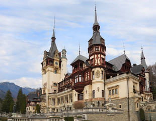 Famous Peles Castle and ornamental garden in Sinaia, Romania, landmark of Carpathian Mountains in...