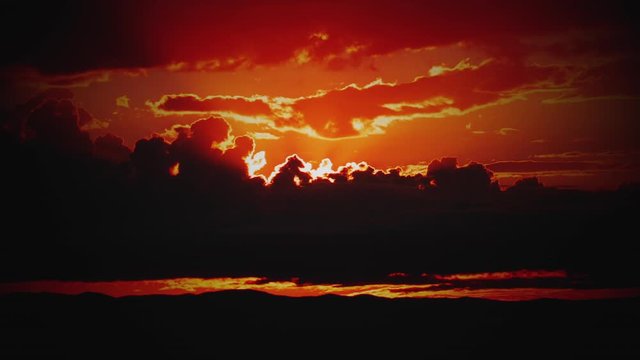 Fire Red Sunrise behind Storm Clouds Time-lapse