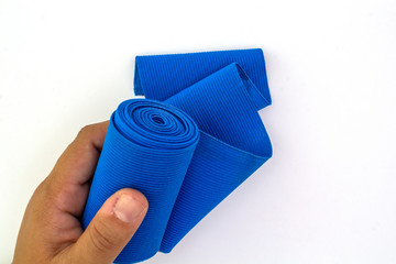 Medical blue elastic Bandage isolated on white background.