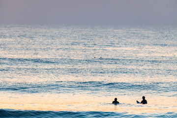 surfing in the Pacific Ocean
