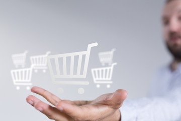 Businessman pressing modern technology panel shopping cart web phone credit card.