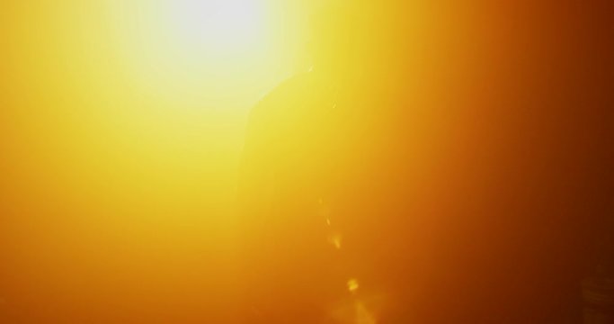 Man doing agility workout in dark gym