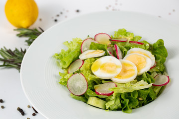 Green salad with radishes and eggs
