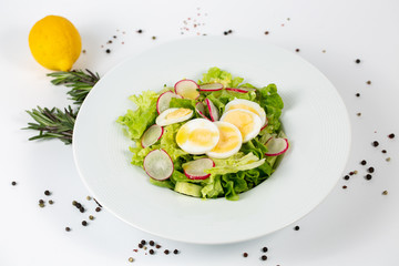 Green salad with radishes and eggs
