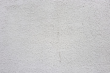 White concrete wall with small protruding peaks
