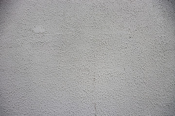 White-gray grungy wall background. gray-white surface