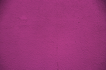 Purple surface with paints frozen during dripping