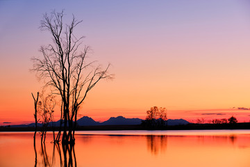 Fototapeta na wymiar Amazing sunset landscape of a peacfel mountain lake in the evening.