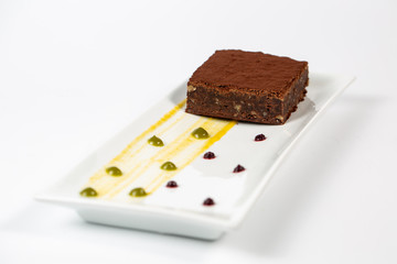 chocolate brownie in plate on a white background