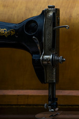 Vintage sewing machine. Retro. History of sewing. Cover, elements and details of a sewing machine close-up. Macro photo.