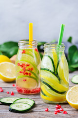 Fototapeta na wymiar Fresh cool lemon cucumber rosemary infused water detox drink