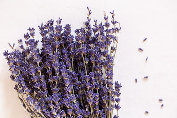 Dry lavender in a bouquet on a light background. Provence style.