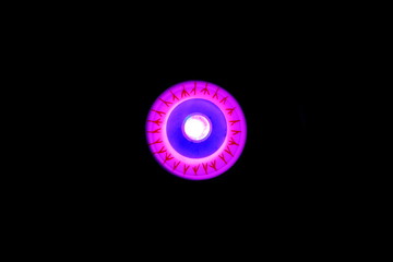 A close up color image of a plastic eyeball with a black background.