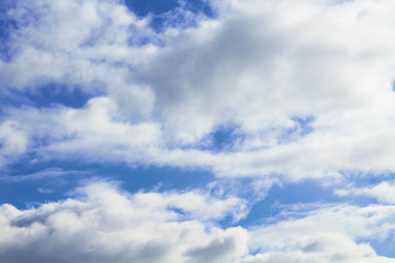 Fototapeta na wymiar Beautiful blue sky and white large cumulus clouds. Close-up. Background. Scenery.