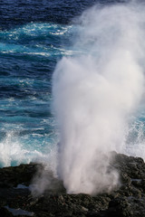 Water bursts through blowhole on Espanola Island, Galapagos National park, Ecuador.