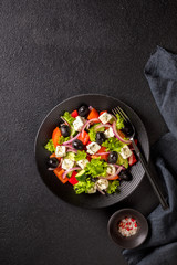 Greek salad of fresh vegetables, olives and feta. Traditional Mediterranean food.