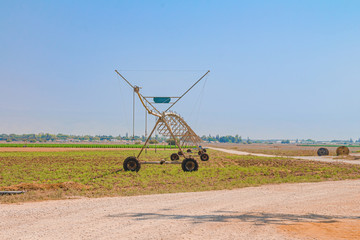 Center pivot sprinkler system in an agricultural field