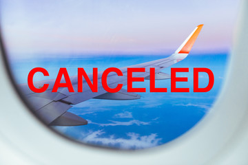Red canceled stamp on view from the plane window, Coronavirus pandemic, covid 19 epidemic, warning...