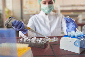 scientict making research in lab analyzing a new virus. corona virus concept