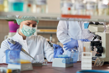 scientict making research in lab analyzing a new virus. corona virus concept