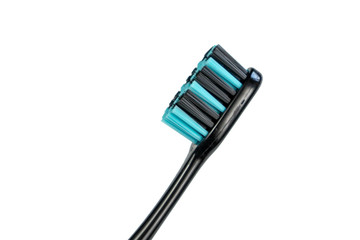 Black toothbrush with blue bristles on a white background isolate