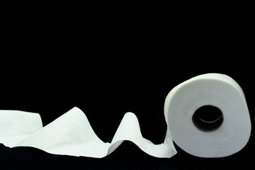 A color image of a roll of white toilet paper with a black background.