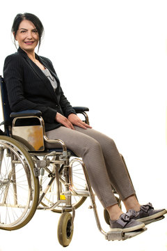 Cheerful businesswoman in wheelchair