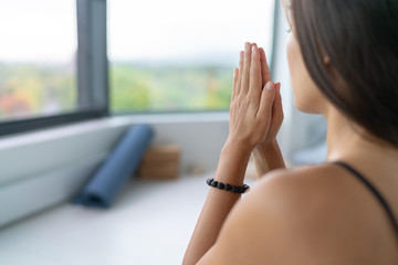 Yoga woman meditating at home for stress free serenity with prayer hands wellness zen calm. - 333526834