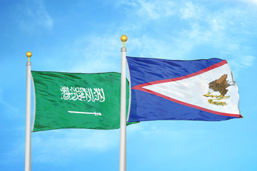Saudi Arabia and American Samoa two flags on flagpoles and blue cloudy sky