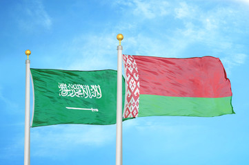 Saudi Arabia and Belarus  two flags on flagpoles and blue cloudy sky